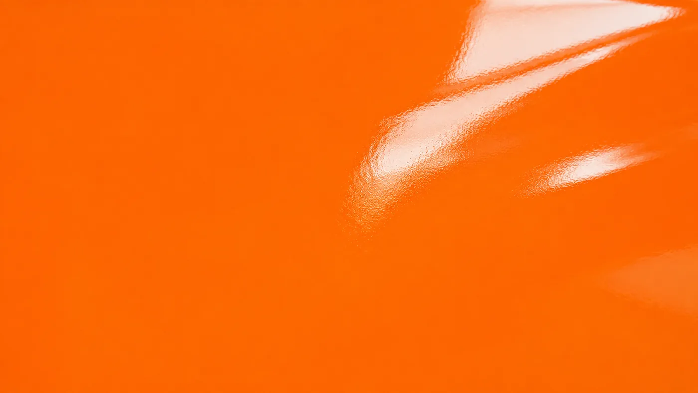 AFTER — the same steel protected with a premium high-gloss BG Group orange coating system